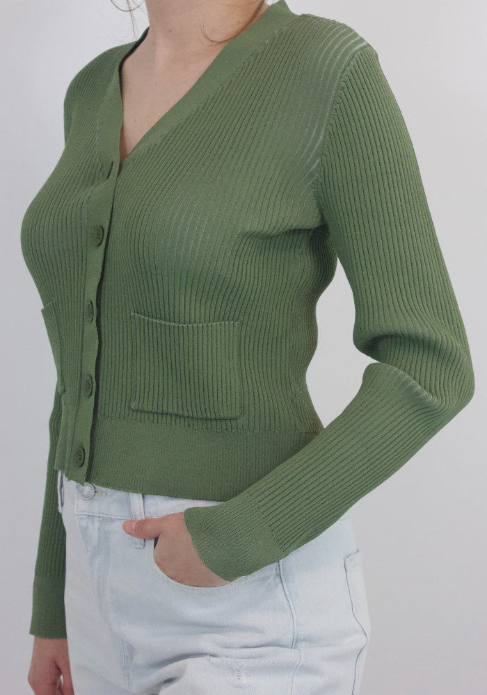 Relish in quiet luxury with this elegant cardigan sweater: a timeless sage green staple with ribbed detail, button closure, and front pockets. Infusing sophisticated and exclusive style into your wardrobe, this cardigan sweater adds effortless chic to any look.