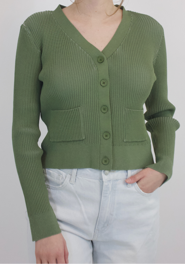 Relish in quiet luxury with this elegant cardigan sweater: a timeless sage green staple with ribbed detail, button closure, and front pockets. Infusing sophisticated and exclusive style into your wardrobe, this cardigan sweater adds effortless chic to any look.